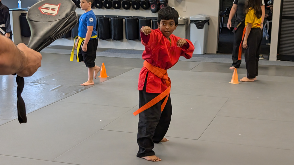 youth karate student practicing a striking form