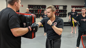 Adult Krav Maga instructor demonstrating a striking technique