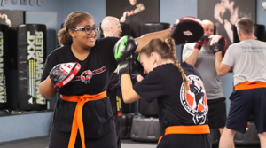 Teen Krav Maga students practicing evasive techniques for self defense