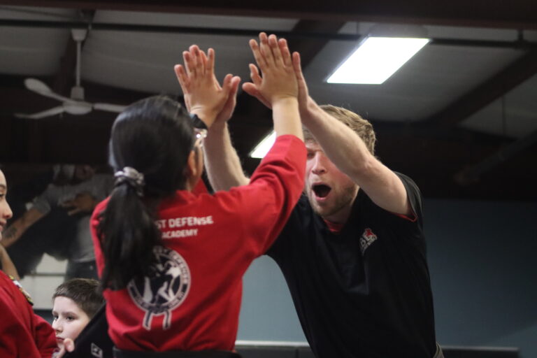 Mr. Kyle High Fives Student