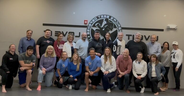 A group of people pose for a picture at a Realtor Safety Class at America's Best Defense Shrewsbury.